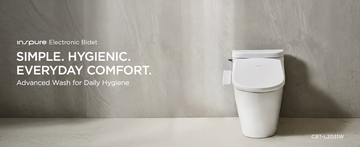 A white Inspure Electronic Bidet toilet seat and lid are shown installed on a white toilet in a minimalist bathroom setting with a textured gray wall and light floor. White text on the left reads 'inspire Electronic Bidet' and 'SIMPLE. HYGIENIC. EVERYDAY COMFORT.