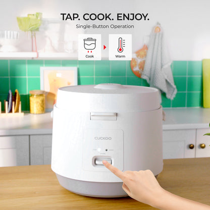 White rice cooker on a kitchen counter with a hand pressing a button, labeled 'Tap. Cook. Enjoy.'